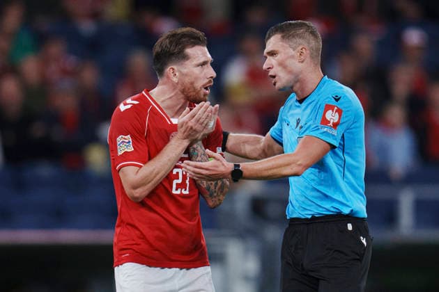 Nations League: Denmark vs. Wales—Denmark’s Pierre-Emile Højbjerg and referee Willy Delajod during the Nations League match between Denmark and Wales at Parken, Sunday, September 27, 2026. Photo by Liselotte Sabroe, Ritzau Scanpix, Copenhagen, Denmark  Copyright: Ritzau Scanpix LiselottexSabroex spdk20260927-211607-L