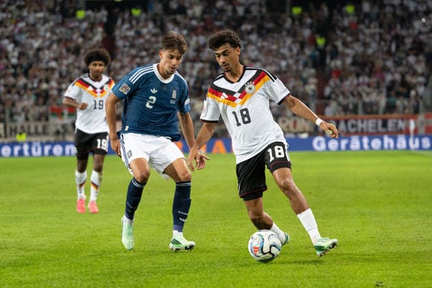 GER, Bavaria, Augsburg, Soccer, Germany vs. Greece, at the WWK Arena, Augsburg, UEFA Nations League, Matchday 2, Group Stage, September 27, 2026, From left: Giorgos Vagiannidis (Greece), 2; Nathaniel Brown (Germany), 18; in attack; tackle. DFL and DFB regulations prohibit any use of photographs as image sequences and or quasi-video, Copyright: HMB-Media MichaelxNibel
