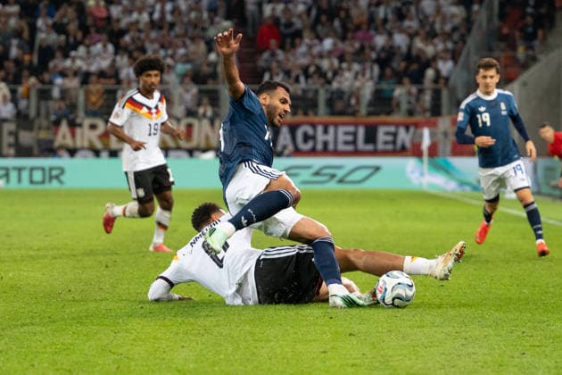GER, Bavaria, Augsburg, Soccer, Germany vs. Greece, at the WWK Arena, Augsburg, UEFA Nations League, Matchday 2, Group Stage, September 27, 2026, From left: Felix Nmecha (Germany), 8; Vangelis Pavlidis (Greece), 14; Graetsche, tackle. DFL and DFB regulations prohibit any use of photographs as image sequences and or quasi-video, Copyright: HMB-Media MichaelxNibel