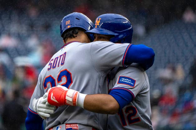 New York Mets short stop Francisco Linder (12) embraces New York Mets left fielder Juan Soto (22) after hitting his 300th career home run in the top of the second inning during a game against the Washington Nationals at Nationals Park in Washington, DC on Sunday, September 27, 2026.  WAP20260927314 BONNIExCASH