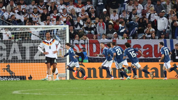 September 27, 2026, xrekx, Soccer UEFA Nations League, Germany vs. Greece: Goal celebration after Dimitrios Kourbelis scores the 0–1 goal for Greece; Felix Nmecha of Germany looks disappointed, dejected, and downcast in Augsburg