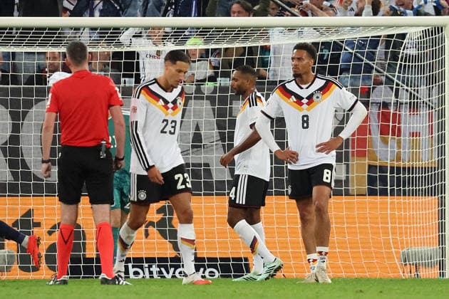 September 27, 2026, xrekx, Soccer UEFA Nations League, Germany vs. Greece: Goal celebration after Dimitrios Kourbelis scores for Greece, 0–1; Younes Ebnoutalib (Germany), Jonathan Tah (Germany), and Felix Nmecha (Germany) look disappointed, dejected, and downcast in Augsburg