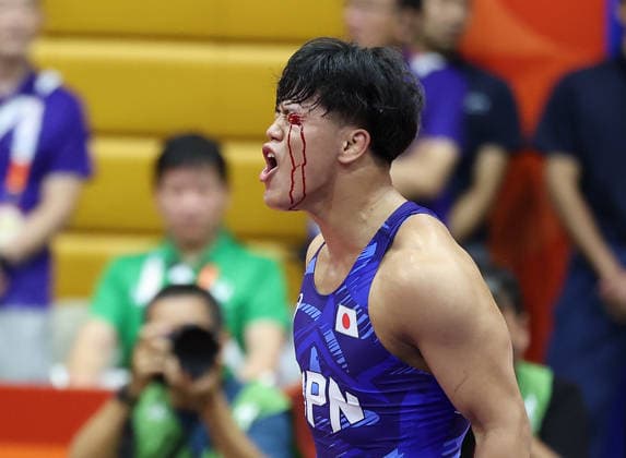 (260930) -- NAGOYA, Sept. 30, 2026 -- Yoshida Taizo of Japan celebrates after winning the men s greco-roman 87kg final of Wrestling against Asan Kurbanovich Zhanyshov of Kyrgyzstan at the 20th Asian Games Aichi-Nagoya 2026 in Nagoya, Japan, Sept. 30, 2026. ) (SP)JAPAN-NAGOYA-ASIAN GAMES-WRESTLING-MEN S GRECO-ROMAN 87KG-FINAL LongxLei 