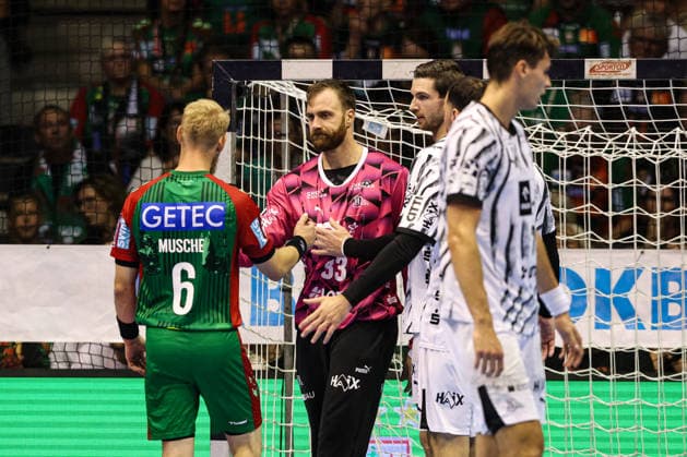 Matthias Musche of SC Magdeburg (6) charges at goalkeeper Andreas Wolff of THW Kiel (33) after hitting him in the face. Handball Bundesliga 2026–2027 season: SC Magdeburg vs. THW Kiel at the GETEC Arena in Magdeburg. Action, Handball,Germany, September 30, 2026