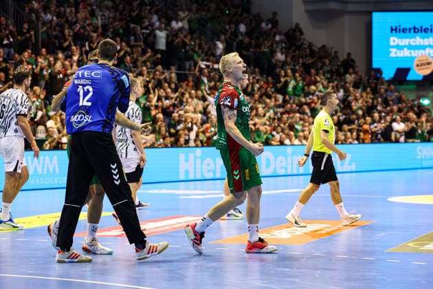 Magnus Saugstrup (SC Magdeburg, No. 23) and goalkeeper Matej Mandic (SC Magdeburg, No. 12), Handball Bundesliga 2026–2027 season, SC Magdeburg vs. THW Kiel at the GETEC Arena in Magdeburg; action, handball,Germany, September 30, 2026
