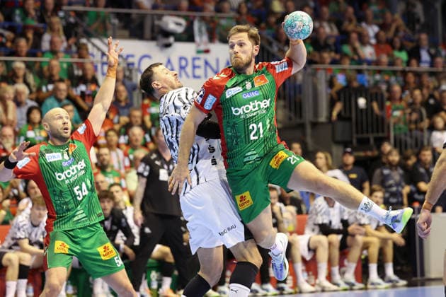 September 30, 2026, xBHAx, Handball, Opel HBL, 2026–2027 season, 1st HBL, SC Magdeburg vs. THW Kiel, GETEC Arena: Albin Lagergren of SC Magdeburg No. 21 on the attack against Domagoj Duvnjak of THW Kiel, Saxony-Anhalt, Germany