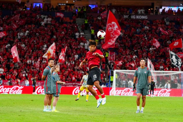 HONG KONG-SPORTS ASEAN-CUP Players of Hong Kong, China conduct stretching and passing drills on the pitch during their pre-match warm-up session ahead of the FIFA ASEAN Cup Tier 2 encounter against Brunei at Kai Tak Stadium on September 30, 2026 in Hong Kong. (Photo by Zulu Lo TMHK via Nexpher Images) Hong Kong