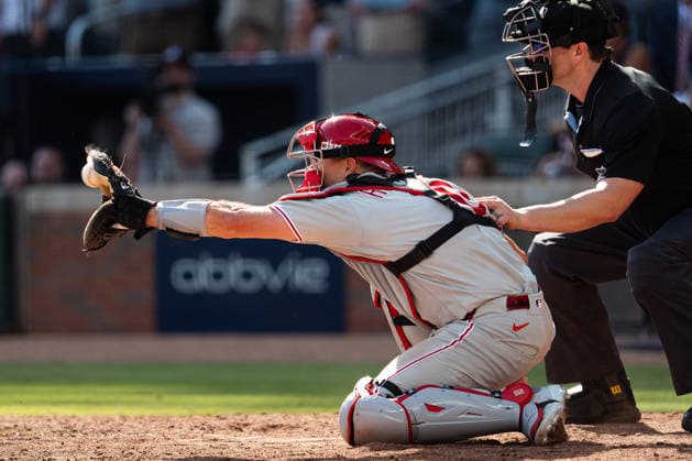 J.T. Realmuto 10 of the Philadelphia Phillies catching the ball in the seventh inning against the Atlanta Braves in game two of the MLB, Baseball Herren, USA National League Wild Card round at Truist Park on Wednesday, September 30, 2026 in Atlanta, Georgia.  ATL20260930110 STEVENxBURROUGHS