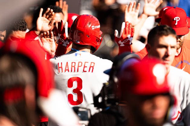 Bryce Harper 3 of the Philadelphia Phillies hits a home run and celebrates in the dugout with teammates in the eighth inning against the Atlanta Braves in game two of the MLB, Baseball Herren, USA National League Wild Card round at Truist Park on Wednesday, September 30, 2026 in Atlanta, Georgia.  ATL20260930127 STEVENxBURROUGHS