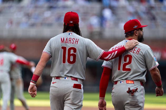 Brandon Marsh 16 of the Philadelphia Phillies celebrating with Kyle Schwarber 12 of the Philadelphia Phillies after they won against the Atlanta Braves in game two of the MLB, Baseball Herren, USA National League Wild Card round at Truist Park on Wednesday, September 30, 2026 in Atlanta, Georgia.  ATL20260930144 STEVENxBURROUGHS