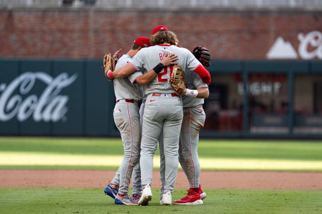 Alec Bohm 28 of the Philadelphia Phillies celebrating with teammates after they won against the Atlanta Braves in game two of the MLB, Baseball Herren, USA National League Wild Card round at Truist Park on Wednesday, September 30, 2026 in Atlanta, Georgia.  ATL20260930145 STEVENxBURROUGHS