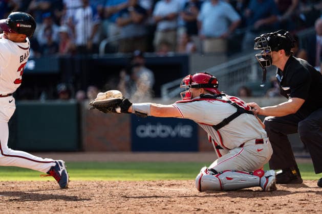 J.T. Realmuto 10 of the Philadelphia Phillies catching the ball in the seventh inning against the Atlanta Braves in game two of the MLB, Baseball Herren, USA National League Wild Card round at Truist Park on Wednesday, September 30, 2026 in Atlanta, Georgia.  ATL20260930111 STEVENxBURROUGHS