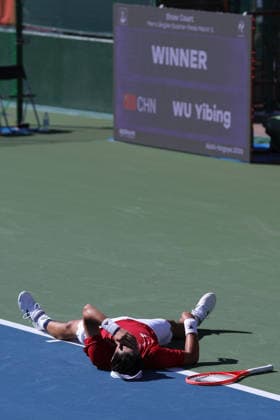 (261001) -- NAGOYA, Oct. 1, 2026 -- Wu Yibing of China celebrates after the men s singles quarterfinals of tennis against Sumit Nagal of India at the 20th Asian Games Aichi-Nagoya 2026 in Nagoya, Japan, Oct. 1, 2026. ) (SP)JAPAN-NAGOYA-ASIAN GAMES-TENNIS-MEN S SINGLES LixBo