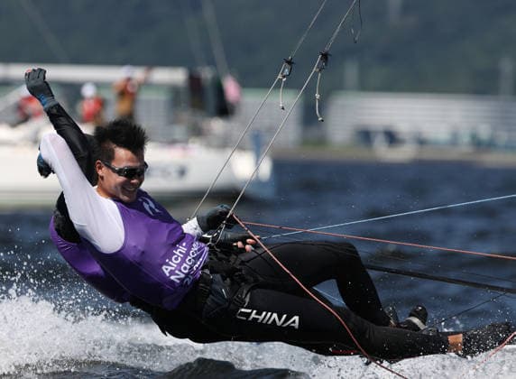 (261001) -- GAMAGORI, Oct. 1, 2026 -- Liu Tian (front) and Wen Zaiding of China celebrate after the Men s Skiff Opening Series Race of Sailing at the 20th Asian Games Aichi-Nagoya 2026 in Gamagori of Aichi Prefecture, Japan, Oct. 1, 2026. ) (SP)JAPAN-GAMAGORI-ASIAN GAMES-SAILING-MEN S SKIFF DengxHua