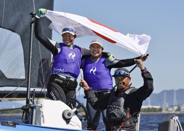 Aichi-Nagoya Asian Games: Sailing Japanese sailors Misaki Tanaka (C) and Sera Nagamatsu celebrate after winning gold in the Aichi-Nagoya Asian Games women s skiff at Kaiyoh Yacht Harbor in Gamagori in Aichi Prefecture, central Japan, on Oct. 1, 2026. A14AA0005629601P