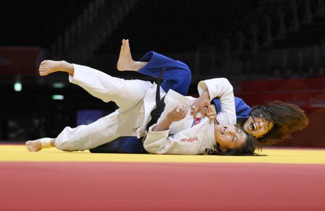 Aichi-Nagoya Asian Games: Judo Japan s Narumi Tanioka (blue) competes against Kim Ji Hye of North Korea in the Aichi-Nagoya Asian Games women s judo 63-kilogram final at Aichi International Arena in Nagoya, central Japan, on Oct. 1, 2026. A14AA0005629632P