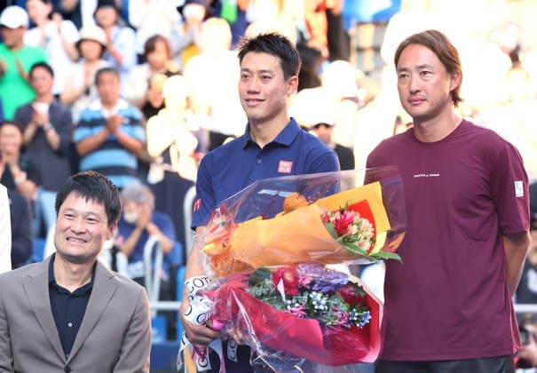 October 1, 2026, Tokyo, Japan - Japan s Kei Nishikori (C) receives flower bouquets from Shingo Kunieda (L) and Go Soeda (R) after the first round match of the Japan Open tennis championship at the Ariake Colosseum in Tokyo on Thursday, October 1, 2026. Nishikori was defeated by Frances Tiafoe of the United States and closed his professional carrier. (photo by Yoshio Tsunoda AFLO) Noxthirdxpartyxsales aflo_352374088 YoshioxTsunodax