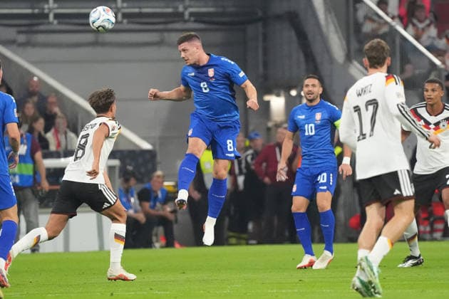 Luka Jovic (Serbia) clears a header, Munich, October 1, 2026, Germany vs. Serbia, UEFA Nations League, Matchday 3, Allianz Arena