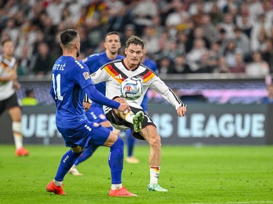 Filip Kostic of Serbia and Florian Wirtz of Germany battle for the ball during the UEFA Nations League 2026–27 group stage match between Germany and Serbia at Allianz Arena on October 1, 2026, in Munich, Germany. Photo by Harry Langer, DeFodi Images