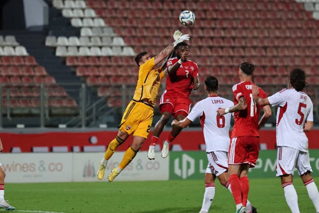 Jaylan Hankins (top, left), goalkeeper of Gibraltar is in action against Joseph Mbong of Malta the UEFA Nations League, League D, Group D1 match between Malta and Gibraltar at the National Stadium, in Ta Qali, Malta, on 01 October, 2026. UEFA Nations League, League D, Group D1 Qualifying; UEFA Nations League;