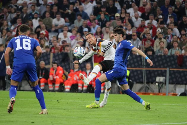 October 1, 2026 Men s Soccer 2026–2027 UEFA Nations League Matchday 3 Germany vs. Serbia Allianz Arena, Munich Said El Mala (Germany, No. 7, in white) takes a shot on goal; Kosta Nedeljkovic (Serbia, No. 2, in blue) arrives too late Munich Bayern Germany