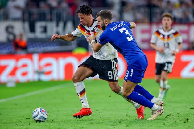 October 1, 2026, Soccer, International Match, Germany vs. Serbia, 2026–2027 UEFA Nations League, Matchday 3, Allianz Arena, Munich, 2026–27 season: Derry Scherhant (GER 9) in a tackle against Strahinja Pavlovic (SER 3). DFB regulations prohibit any use of photographs as image sequences and or quasi-video. Bayern Munich, Germany