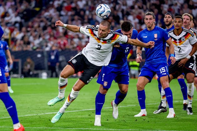 October 1, 2026, Soccer, International Match, Germany vs. Serbia, 2026–2027 UEFA Nations League, Matchday 3, Allianz Arena, Munich, 2026–27 Season, Waldemar Anton (GER 3) in a duel against Dejan Joveljic (SER 9), penalty area play, header. DFB regulations prohibit any use of photographs as image sequences and or quasi-video. Bayern, Germany