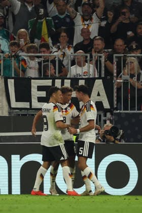 MUNICH, GERMANY - OCTOBER 01: Tom Bischof of Germany national team, Nationalteam celebrates with Derry Scherhant and Aleksandar Pavlovic after scoring the first goal during the UEFA Nations League 2026 27 League A match between Germany and Serbia at Allianz Arena on October 01, 2026 in Munich, Germany. Germany National team v Serbia National team Copyright: xx