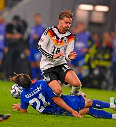 October 1, 2026, Soccer: 2026–2027 UEFA Nations League, Matchday 3, Germany vs. Serbia, at the Allianz Arena in Munich: Lazar Samardzic (Serbia) vs. Maximilian Mittelstädt (Germany)