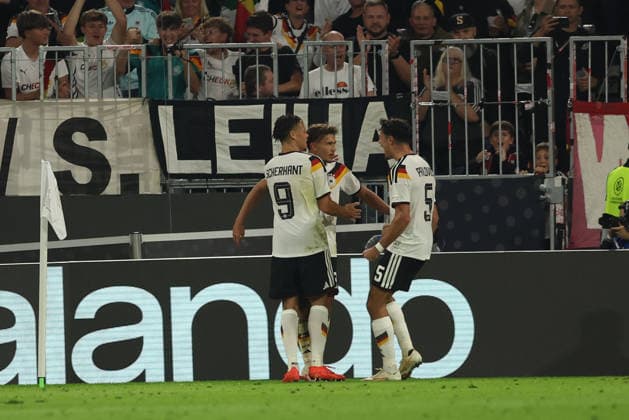 MUNICH, GERMANY - OCTOBER 01: Tom Bischof of Germany national team, Nationalteam celebrates with Derry Scherhant and Aleksandar Pavlovic after scoring the first goal during the UEFA Nations League 2026 27 League A match between Germany and Serbia at Allianz Arena on October 01, 2026 in Munich, Germany. Germany National team v Serbia National team Copyright: xx