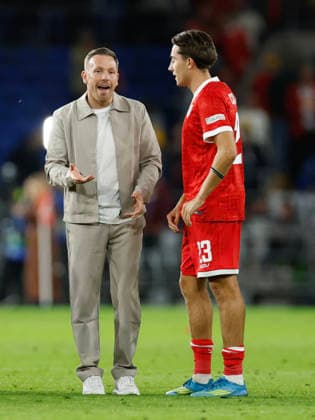 Cardiff, Wales, 1st October 2026. Craig Bellamy coach of Wales and Joel Colwill of Wales react at full time during the Wales vs Norway UEFA Nations League match at the Cardiff City Stadium, Cardiff. Picture credit should read: Cody Froggatt Sportimage EDITORIAL USE ONLY. No use with unauthorised audio, video, data, fixture lists, club league logos or live services. Online in-match use limited to 120 images, no video emulation. No use in betting, games or single club league player publications. SPI_136_CF_WALES_NORWAY SPI-5050-0136