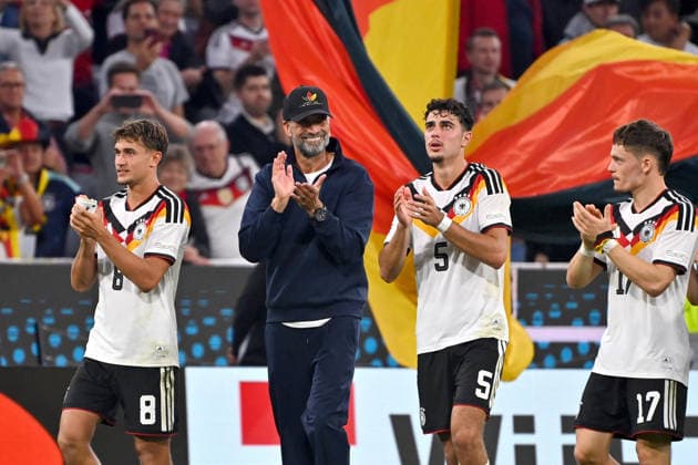 Celebration at the final whistle: from left, Tom BISCHOF (GER), national team coach Juergen KLOPP (GER), Aleksandar PAVLOVIC (GER), Florian WIRTZ (GER); celebration, joy, excitement, action—Nations League group stage, Group B, Matchday 3: Germany (GER) vs. Serbia (SRB) 2–0 on October 1, 2026, at the Allianz Arena