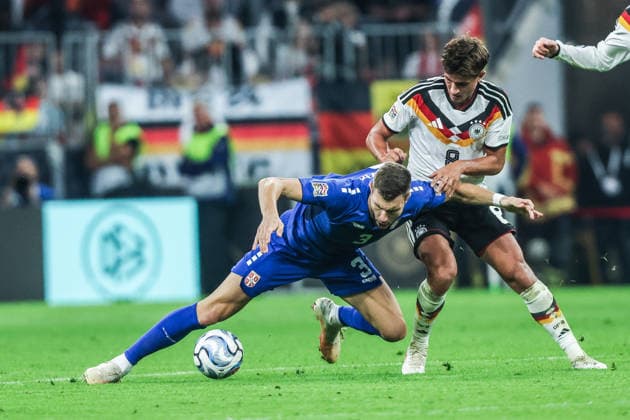 Sports, Soccer, UEFA Nations League 2026–2027 Season, Group A2, Matchday 3: Germany vs. Serbia, October 1, 2026, Allianz Arena; Strahinja Pavlovic (Serbia), 3; Tom Bischof (Germany), 8; Tackle; Munich, Allianz Arena, Bavaria, Germany