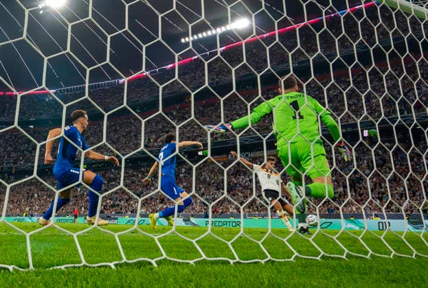 October 1, 2026, Soccer: 2026–2027 UEFA Nations League, Matchday 3, Germany vs. Serbia, at the Allianz Arena in Munich—Tom Bischof of Germany scores the 1–0 goal against Serbia’s goalkeeper Djordje Petrovic
