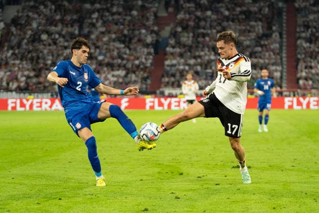 Kosta Nedeljkovic (2), Serbia, and Florian Wirtz (17), Germany, in action during the UEFA Nations League match between Germany and Serbia on October 1, 2026, in Munich at the Allianz Arena, Bavaria, Germany