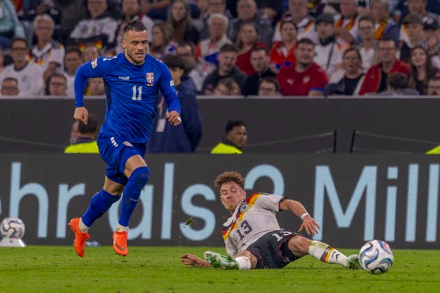 Munich, Germany October 1, 2026 UEFA Nations League 2026–2027 League Phase Group A2 Match 3 Germany vs. Serbia Pictured from left: Filip Kostic (SRB) and Philipp Treu (GER) in a tackle DFB and DFL regulations prohibit any use of photographs as image sequences and or quasi-video Allianz Arena Bayern Copyright: xFotostandx xSchäferx