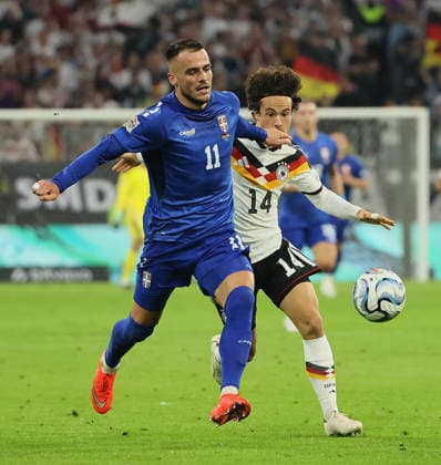 October 1, 2026, Nations League, Germany vs. Serbia, Allianz Arena, Munich, Soccer, Pictured: Filip Kostic (Serbia) vs. Mika Baur (Germany)