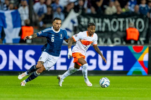 THESSALONIKI Greek midfielder Dimitris Kourbelis and Dutch forward Crysencio Summerville during the UEFA Nations League match between Greece and the Netherlands at Toumba Stadium on October 1, 2026, in Thessaloniki, Greece. Photo by DeFodi Images