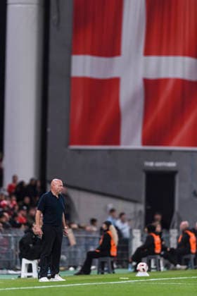 Denmark v Portugal - UEFA Nations League 2026 2027 Copenhagen, Denmark - October 1: Denmark Head Coach Brian Riemer looks on with a big Denmark flag next to him during the UEFA Nations League 2026 2027 group D match between Denmark and Portugal at Parken Stadium on October 1, 2026 in Copenhagen, Denmark Copenhagen Parken Stadium Denmark Copyright: xLatinxSportxImagesx