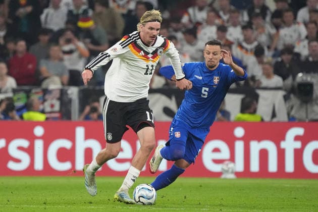 Nick Woltemade (Germany) vs. Nemanja Maksimovic (Serbia), Munich, October 1, 2026; Germany vs. Serbia, UEFA Nations League, Matchday 3, Allianz Arena