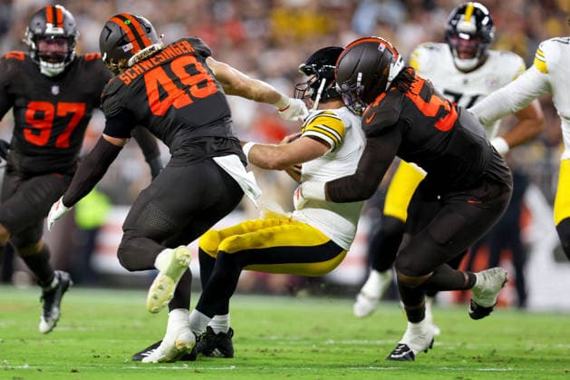 CLEVELAND, OH - OCTOBER 01: Cleveland Browns defensive end Isaiah McGuire (57) sacks Pittsburgh Steelers quarterback Aaron Rodgers (8) during the second quarter of the National Football League game between the Pittsburgh Steelers and Cleveland Browns on October 1, 2026, at Huntington Bank Field in Cleveland, OH. (Photo by Frank Jansky Icon Sportswire) NFL, American Football Herren, USA OCT 01 Steelers at Browns EDITORIAL USE ONLY Icon261001034