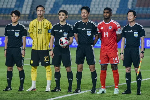 October 1, 2026, Bandung, West Java, Indonesia: Malaysia national team, Nationalteam captain DION COOLS (2L) poses for a photo with the referee and Singapore national team captain HARUN HARISS (2R) before the match at FIFA ASEAN Cup 2026 match between Malaysia and Singapore at Si Jalak Harupat Stadium in Bandung, Indonesia. Malaysia wins 6-0. FIFA ASEAN CUP 2026: Malaysia Vs Singapore 6:0  - ZUMAr272 0868392070st Copyright: xDimasxRachmatsyahx