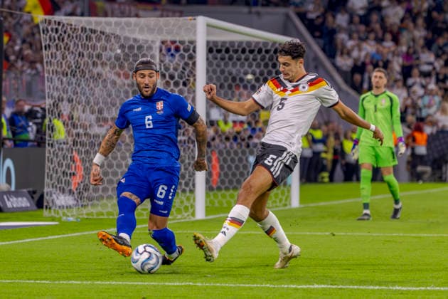 Munich, Germany October 1, 2026 UEFA Nations League 2026–2027 League Phase Group A2 Match 3 Germany vs. Serbia Pictured from left in a tackle: Nemanja Gudelj (SRB) and Aleksandar Pavlovic (GER). DFB and DFL regulations prohibit any use of photographs as image sequences and or quasi-video. Allianz Arena, Bayern Copyright: xFotostandx xSchäferx
