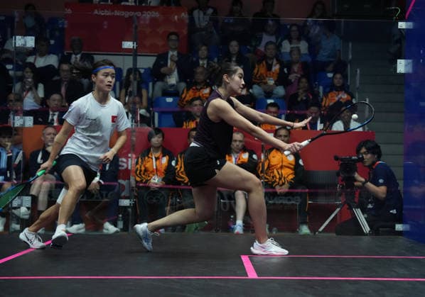 (261002) -- NAGOYA, Oct. 2, 2026 -- Lee Ka Yi (L) of team China s Hong Kong competes against Aira Azman of team Malaysia during the Women s Team Gold Medal Match of Squash at the 20th Asian Games Aichi-Nagoya 2026 in Nagoya, Japan, Oct. 2, 2026. ) (SP)JAPAN-NAGOYA-ASIAN GAMES-SQUASH-WOMEN S TEAM-GOLD MEDAL MATCH JiaxYuchen 