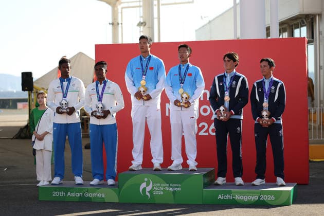 (261002) -- GAMAGORI, Oct. 2, 2026 -- Gold medalists Liu Tian (3rd L) Wen Zaiding (3rd R) of team China pose for photos with silver medalists Manu Francis (1st L) Prince Kurisinkal Noble (2nd L) of team India and bronze medalists Russell Williams Aylsworth (2nd R) Akira Luke Sakai of Hong Kong of China during the awarding ceremony for the Men s Skiff of Sailing at the 20th Asian Games Aichi-Nagoya 2026 in Gamagori of Aichi Prefecture, Japan, Oct. 2, 2026. ) (SP)JAPAN-GAMAGORI-ASIAN GAMES-SAILING-MEN S SKIFF DengxHua