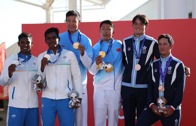 (261002) -- GAMAGORI, Oct. 2, 2026 -- Gold medalists Liu Tian (3rd L) Wen Zaiding (3rd R) of team China pose for photos with silver medalists Manu Francis (1st L) Prince Kurisinkal Noble (2nd L) of team India and bronze medalists Russell Williams Aylsworth (2nd R) Akira Luke Sakai of Hong Kong of China during the awarding ceremony for the Men s Skiff of Sailing at the 20th Asian Games Aichi-Nagoya 2026 in Gamagori of Aichi Prefecture, Japan, Oct. 2, 2026. ) (SP)JAPAN-GAMAGORI-ASIAN GAMES-SAILING-MEN S SKIFF DengxHua 