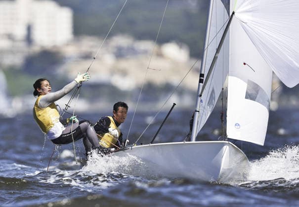 Aichi-Nagoya Asian Games: Sailing Japanese sailors Yurie Seki (L) and Tetsuya Isozaki compete en route to winning the Aichi-Nagoya Asian Games mixed dinghy gold off Kaiyoh Yacht Harbor in Gamagori in Aichi Prefecture, central Japan, on Oct. 2, 2026.  A14AA0005629734P