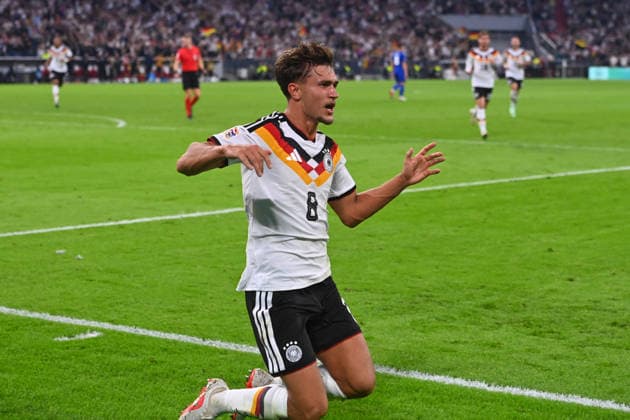 Tom BISCHOF (GER) celebrating after scoring the 1-0 goal: celebration, joy, excitement, action, single frame, cropped shot, half-length portrait, soccer Nations League group stage, Group B, Matchday 3: Germany (GER) vs. Serbia (SRB) 2–0 on October 1, 2026, Allianz Arena