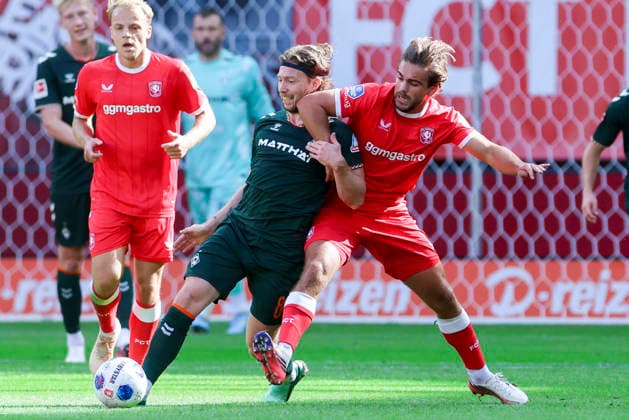 Mitchell Weiser of Werder Bremen and Bart van Rooij of FC Twente Enschede battle for the ball during the friendly match between FC Twente Enschede and Werder Bremen at De Grolsch Veste on October 2, 2026, in Enschede, Netherlands Photo by Marco Steinbrenner, DeFodi Images Mitchell Weiser of Werder Bremen and Bart van Rooij of FC Twente Enschede battle for the ball during the friendly match between FC Twente Enschede and Werder Bremen at De Grolsch Veste on October 2, 2026, in Enschede, Netherlands. Photo by Marco Steinbrenner, DeFodi Images. Photo by Marco Steinbrenner, DeFodi Images.