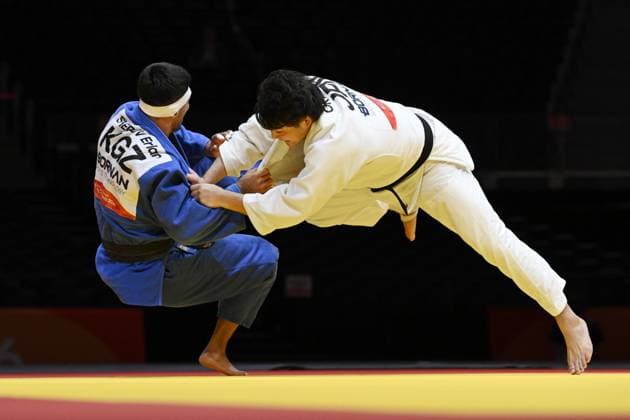 Aichi-Nagoya Asian Games: Judo Japan s Riku Okada (white) competes en route to beating Erlan Sherov of Kyrgyzstan in the Aichi-Nagoya Asian Games men s judo 90-kilogram final at Aichi International Arena in Nagoya, central Japan, on Oct. 2, 2026.  A14AA0005629757P